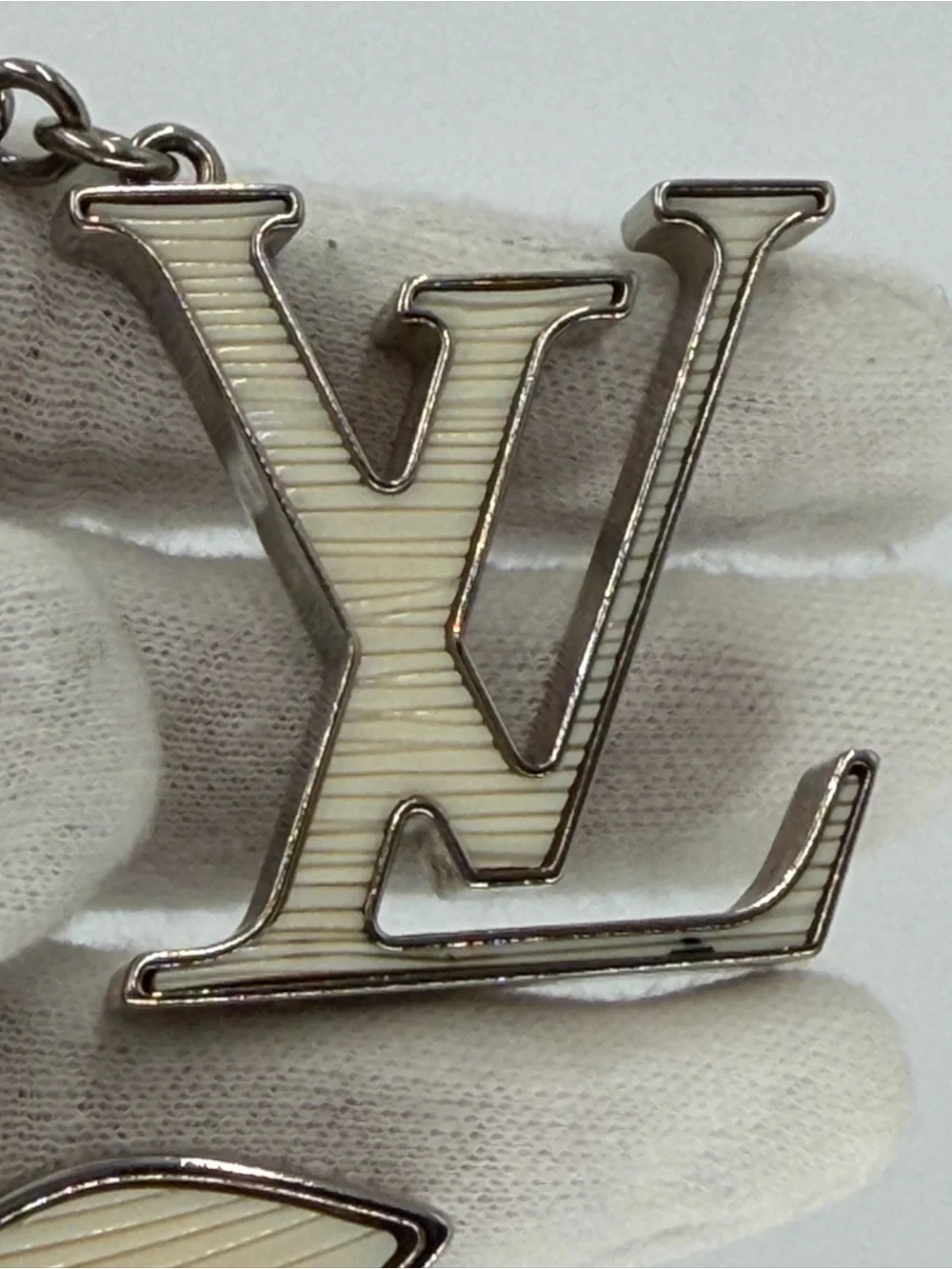 Authentic Louis Vuitton Fleur d’Epi Silver & Cream Bag Charm w/Dust Bag and COA